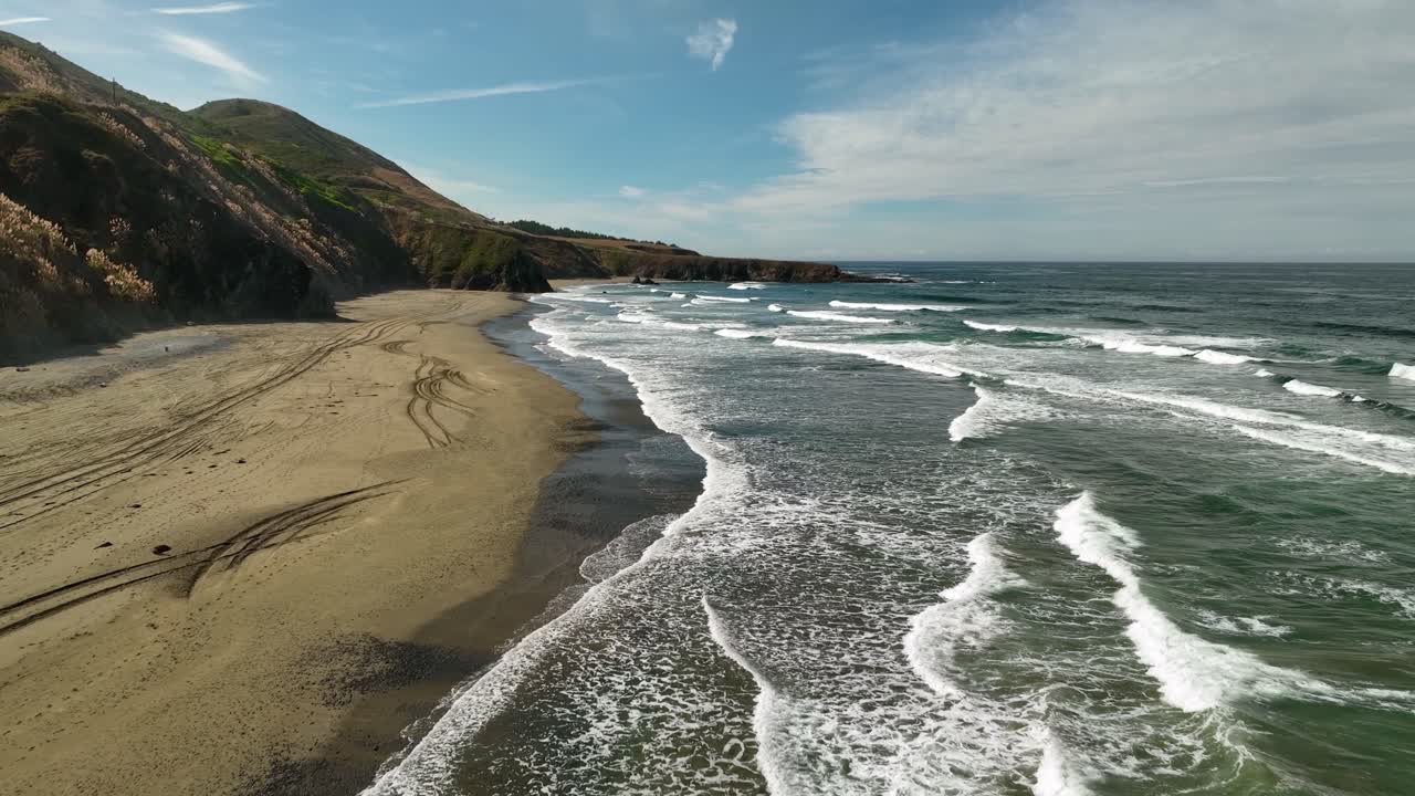 Drone shot of California's beautiful sandy beaches at midday