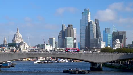 tfl buses crossing waterloo bridge, london, united kingdom