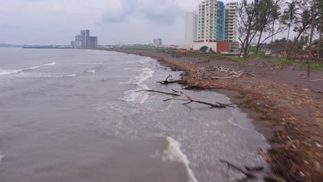 aerial rising forward view polluted contaminated beach veracruz cloudy day