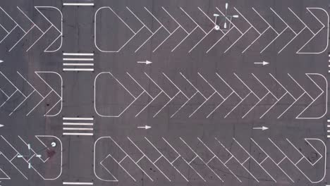 empty car park with white markings near the supermarket - aerial panorama shot