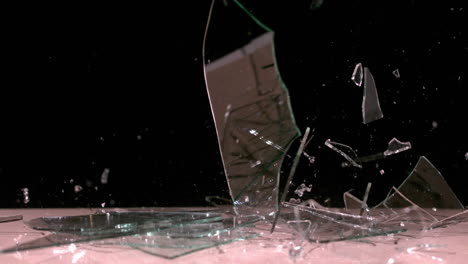 Glass-falling-and-smashing-into-pieces