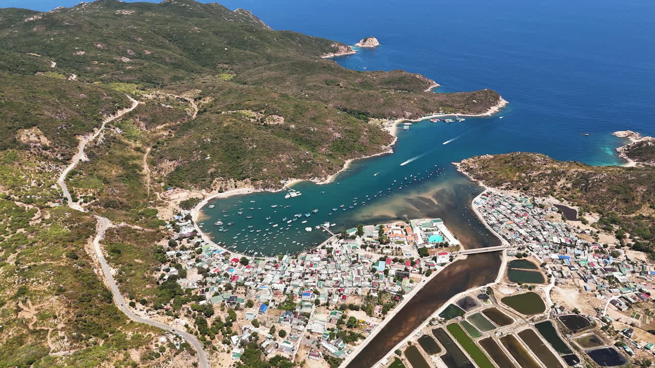 Spectacular High Aerial Zoom In (Establishing Shot) Over Vinh Hy Bay, Vietnam. Travel, Experience, And Explore The Natural Wonders Of Nui Chua National Park.