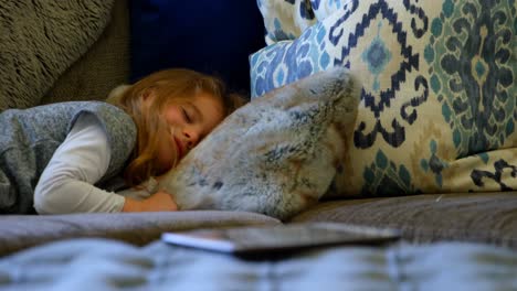 girl sleeping on sofa in living room 4k