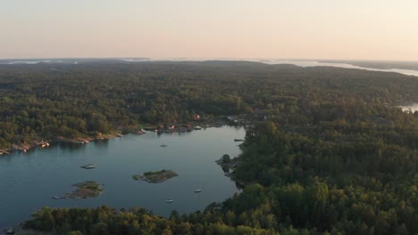 drone shot of stockholm archipelago in sweden during sunset