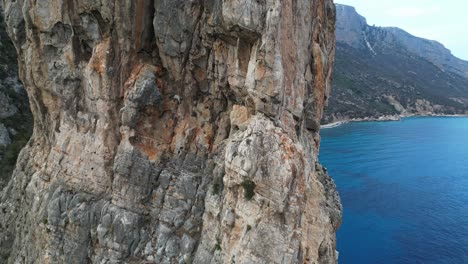 stunning aerial view of a dramatic cliff overlooking the azure mediterranean sea