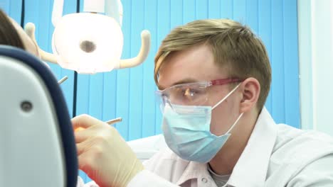 dentist examining patient's teeth