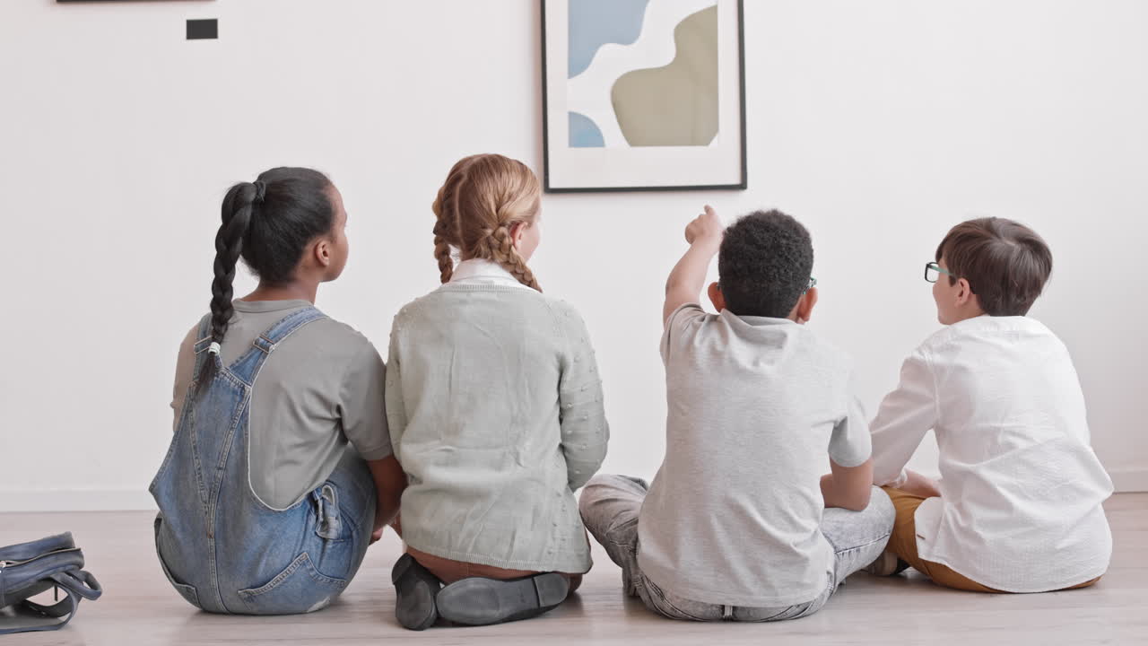 Kids Sitting on Floor of Art Gallery