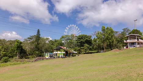 this is a time-lapse of a ferris wheel in tagaytay, philippines. the tagaytay picnic grove is an excellent place for families to spend a relaxing day having fun with their loved ones.