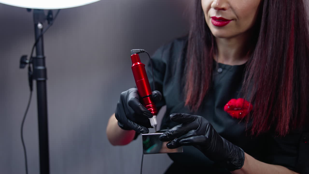 Pretty woman cosmetologist working with permanent make up. Close up view of cosmetology permanent technologies.