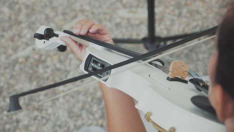 woman violonist playing in slow motion downward