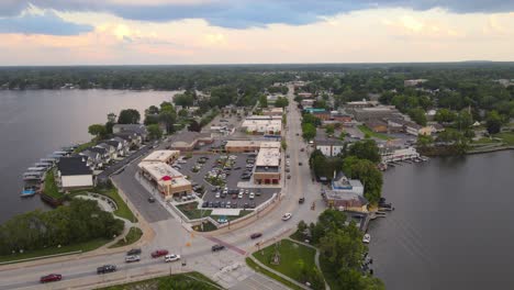 main road leading through downtown of belleville in michigan, surrounded with lakes, aerial