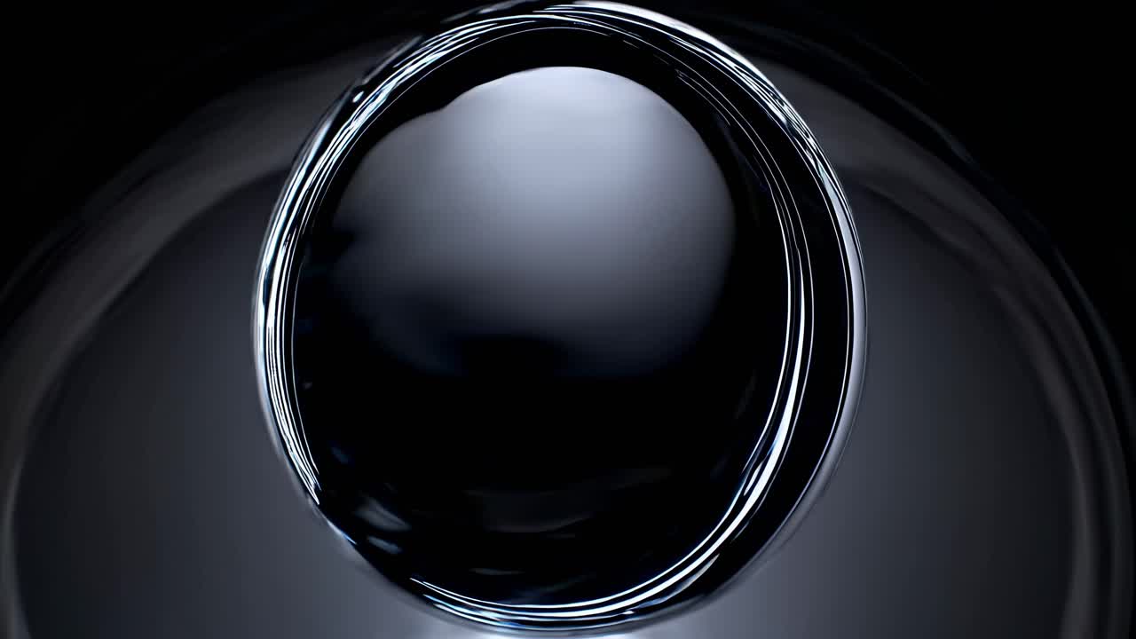 Abstract video concept with a top-down angle, showcasing a glossy, reflective black surface
