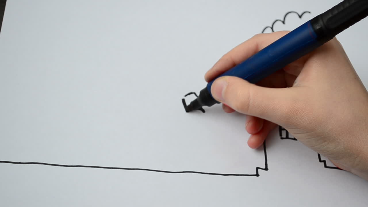 Il costruttore disegna davanti alla casa. Processo di disegno