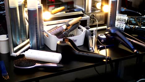 make-up artist table with hair products and tools in 4k slow motion 60fps
