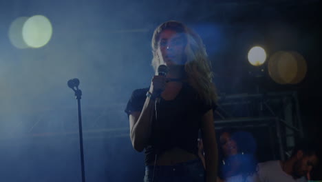 lead singer gripping mic on smoky music stage, animated sound waves dancing under blue spotlights