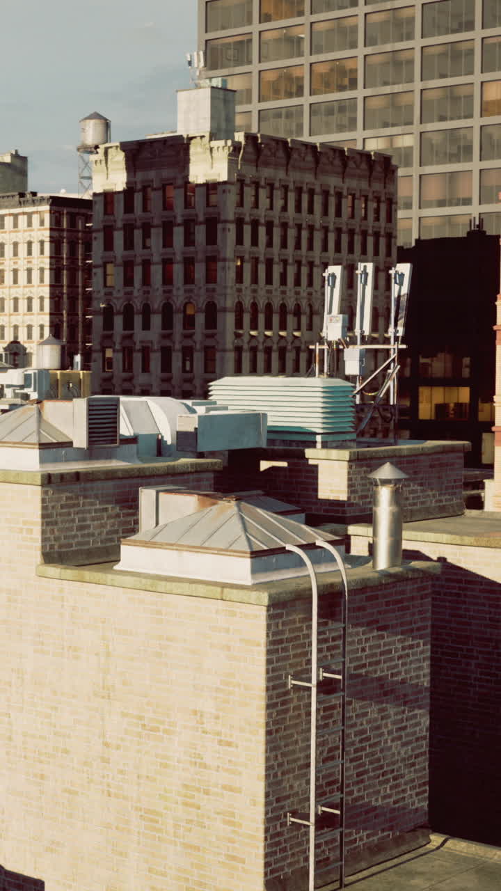 Rooftop view of urban architecture under a clear sky on a sunny day
