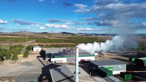 factory emites smoke pollution contamination on a windy day in spain