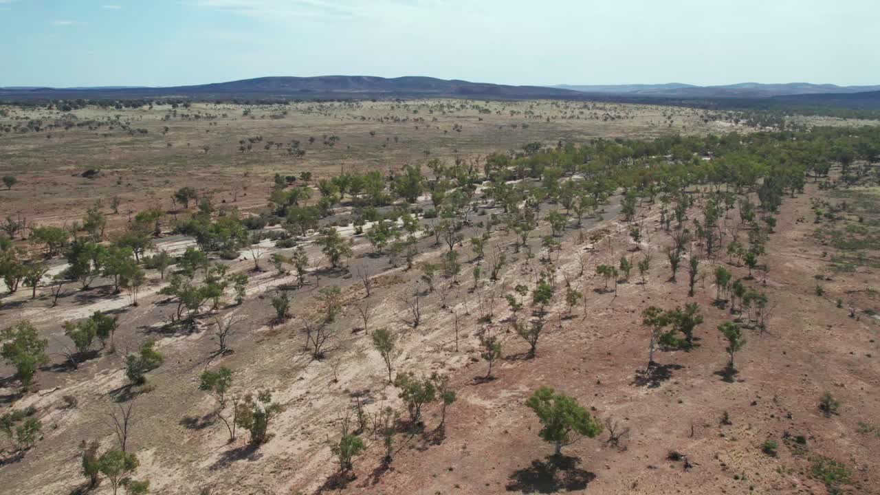 Aerial footage of the dry Hugh River near the Stuart Highway in the Northern Territory, Australia. August 2022.