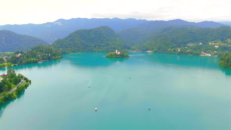 stunning drone footage of lake bled, slovenia, showcasing the iconic island, castle, and lush landscapes. experience breathtaking aerial views of the crystal-clear lake and surrounding mountains.