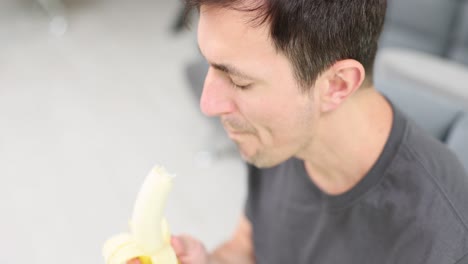 man eating a banana