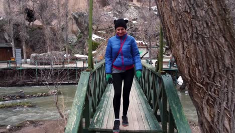 tourist walking on the bridge in ιhlara valley in cappadocia, turkey