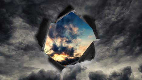 a hole with torn edges in the rainy sky through which you can see the beautiful sky at sunset.