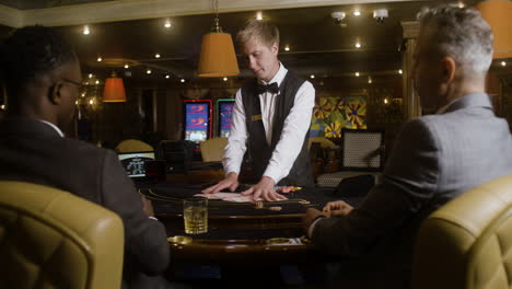 croupier shuffling poker cards.