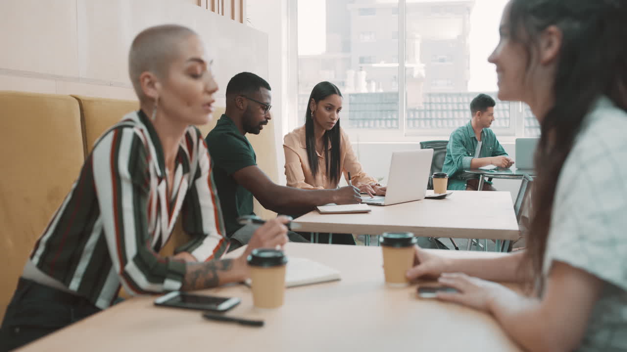 Group of diverse businesspeople working in a cafe