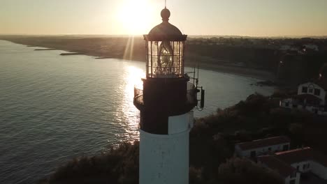 biarritz lighthouse at dusk with sea in background, france