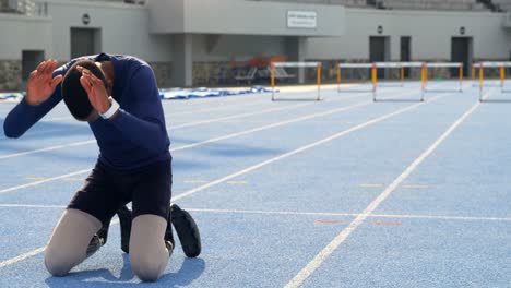 disabled athletic relaxing on a running track 4k