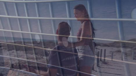 animación de la red sobre una feliz pareja caucásica en la playa
