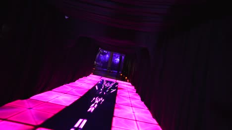 empty dance floor of nightclub with illumination, purple and pink party