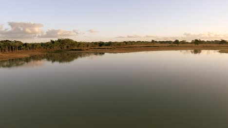 Aerial-forward-over-lagoon-waters-at-Altagracia,-Higuey-in-Dominican-Republic