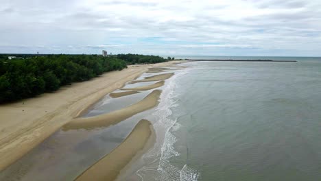 thailand's cha-am beach; aerial dolly drone shot
