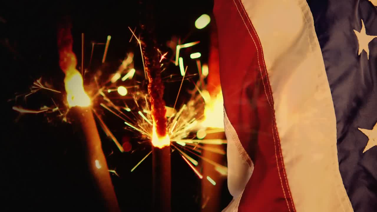 Digital animation of sparklers and american flag at night 4k