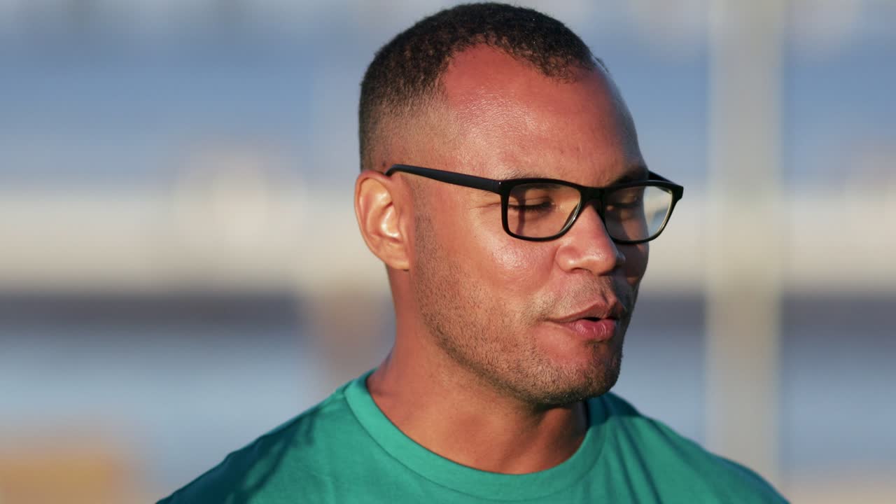 Smiling man in green t-shirt