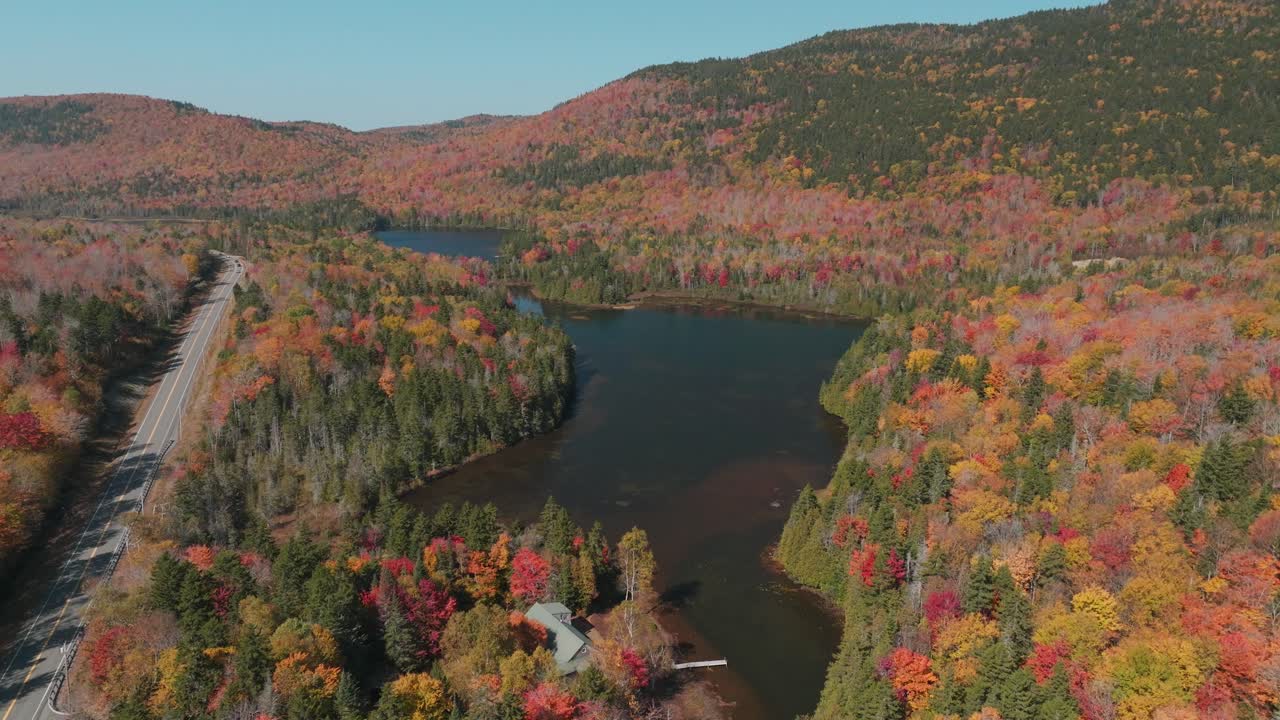Aerial View of Autumn Foliage and Pond Along Route 4 in Western Maine - Scenic Fall Landscape