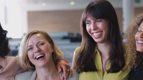 Portrait-Of-Smiling-Female-Business-Team-Working-In-Modern-Office-Together