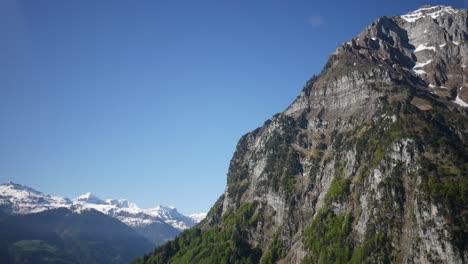 Aerial-view-from-inside-a-civil-propeller-plane,-flying-over-Switzerland