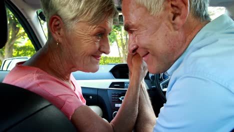 senior couple romancing in car 4k