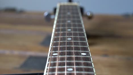 guitar string vibrating in slow motion,  close up