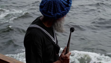 sailor with a pipe by the sea