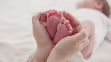 feet, hands and mother with baby