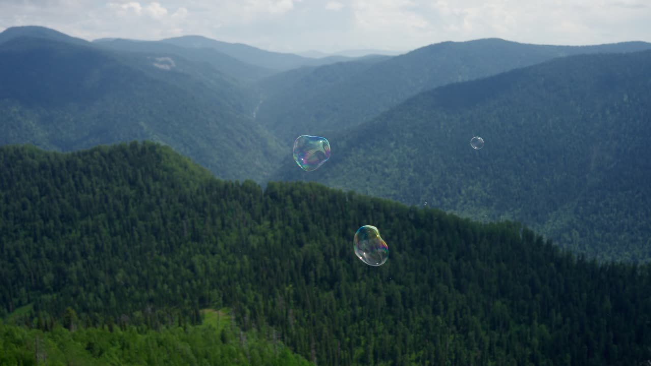 Soap Bubbles Over Mountain Peaks