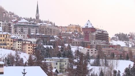 establishing shot of the town of st moritz switzerland in winter 1