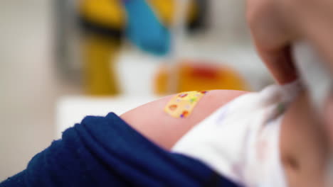 doctor-puts-sticking-plaster-to-baby-after-vaccination