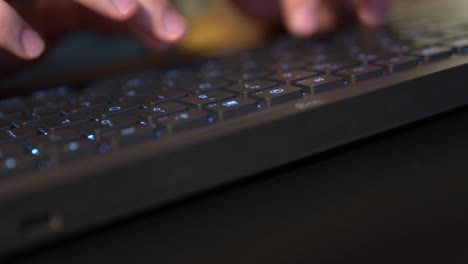 Sliding-shot-of-male-hand-typing-on-keyboard