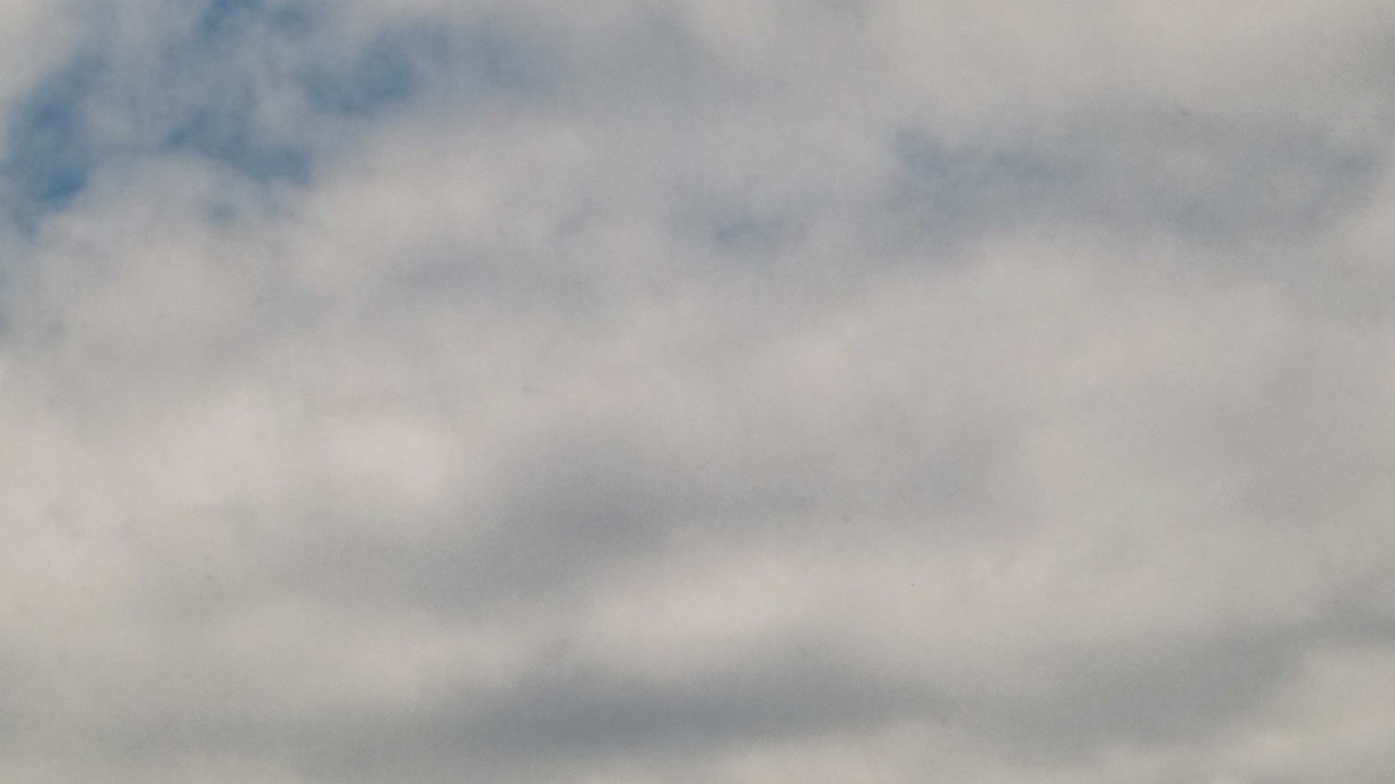 A sunny summer day, time-lapse shot of the sky at an angle