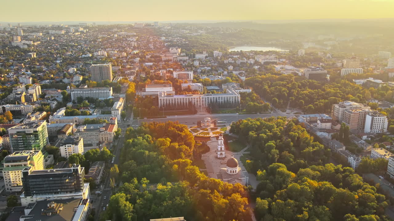 Aerial drone view of Chisinau downtown at sunset. Panorama view of Central Park, Cathedral, Goverment a lot of greenery, buildings. Moldova