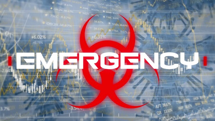 Hazard sign with Emergency text against against stock market data processing
